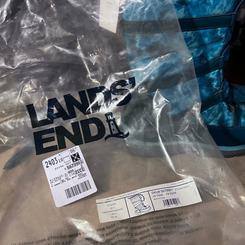 Lands’ End Ocean blue and print calf height boots. 
Size 7US; 9 EU; 6 UK